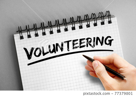 Volunteering text on notepad, concept background Volunteering text on notepad, concept background 77379801