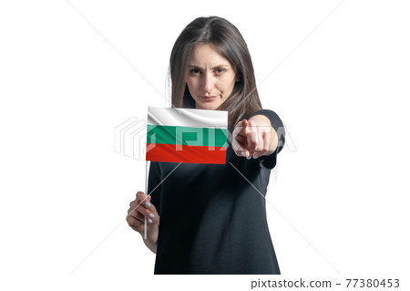 Happy young white woman holding flag of Bulgaria and points forward in front of him isolated on a white background 77380453