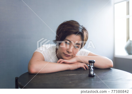 Woman spending time at home Woman spending time at home 77380842