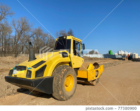 Construction site is laying new asphalt road pavement,road construction workers and road construction machinery scene.highway construction site landscape Construction site is laying new asphalt road pavement,road construction workers and road construction machinery scene.highway construction site landscape 77380900