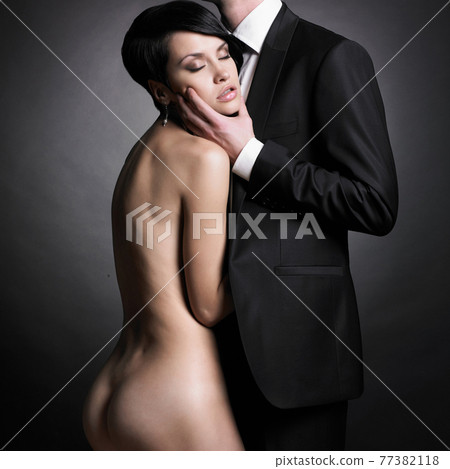 Portrait of young elegant couple. Sexy beautiful lovers 77382118