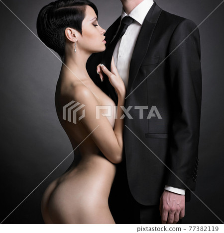 Portrait of young elegant couple. Sexy beautiful lovers 77382119