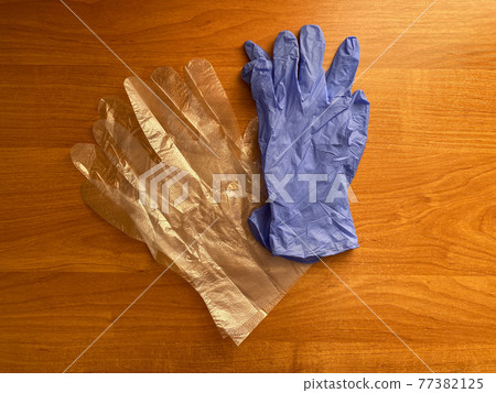 Blue latex gloves. Gloves for the food industry. Disposable plastic gloves is universal protection Blue latex gloves. Gloves for the food industry. Disposable plastic gloves is universal protection 77382125