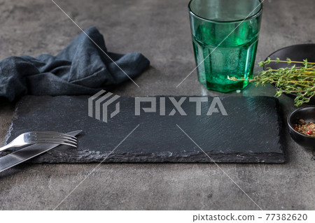 empty black stone plate 77382620