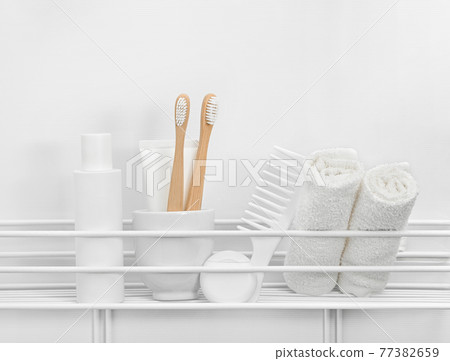 Personal care and hygiene toiletries in white bath 77382659