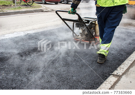 asphalt rammer. laying the road surface 77383660