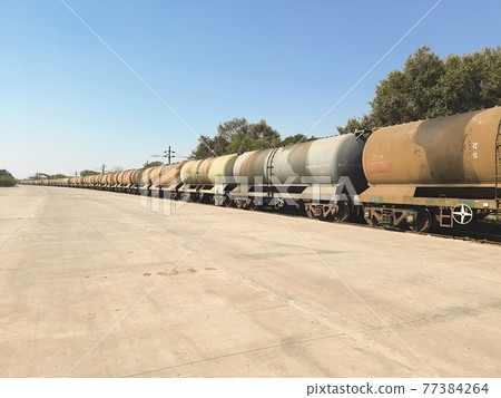 Indian train on a railway Indian train on a railway 77384264