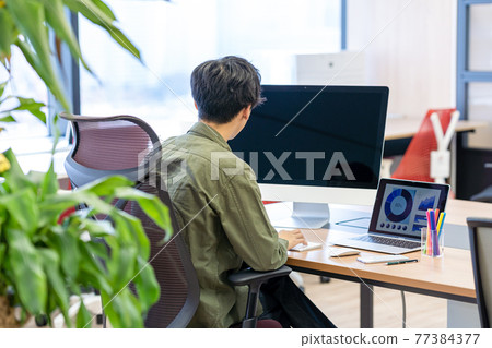 Working businessman Working businessman 77384377