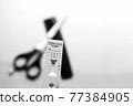 Testing Before Visiting The Hairdresser: Rapid Antigen Corona Test Showing A Negative Result In Front of Scissors and Comb 77384905