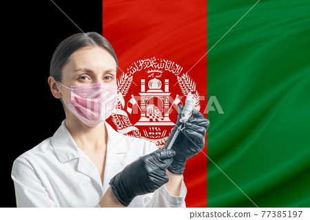Girl doctor prepares vaccination against the background of the Afghanistan flag. Vaccination concept Afghanistan Girl doctor prepares vaccination against the background of the Afghanistan flag. Vaccination concept Afghanistan 77385197