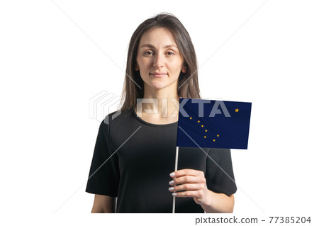 Happy young white girl holding Alaska flag isolated on a white background Happy young white girl holding Alaska flag isolated on a white background 77385204