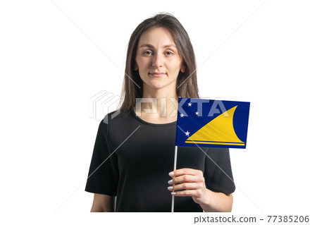Happy young white girl holding Tokelau flag isolated on a white background Happy young white girl holding Tokelau flag isolated on a white background 77385206