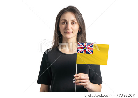 Happy young white girl holding Niue flag isolated on a white background Happy young white girl holding Niue flag isolated on a white background 77385207