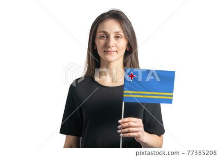 Happy young white girl holding Aruba flag isolated on a white background Happy young white girl holding Aruba flag isolated on a white background 77385208