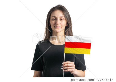Happy young white girl holding South Ossetia flag isolated on a white background 77385212