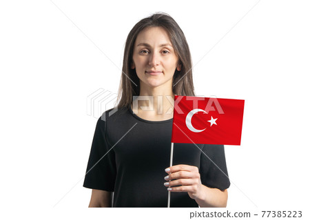 Happy young white girl holding Turkey flag isolated on a white background Happy young white girl holding Turkey flag isolated on a white background 77385223