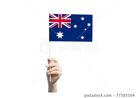Beautiful female hand holding Australia flag, isolated on white background Beautiful female hand holding Australia flag, isolated on white background 77385504