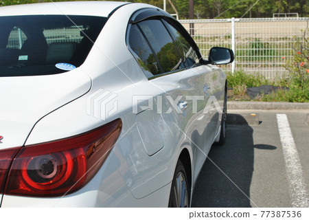 White sporty car White sporty car 77387536