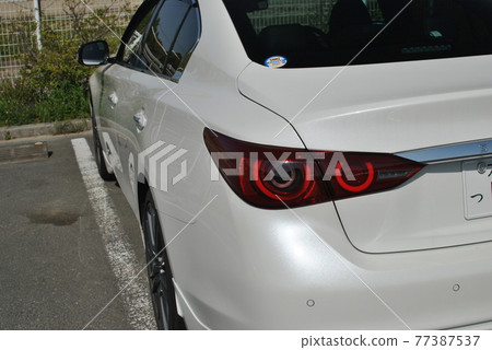 White sporty car White sporty car 77387537