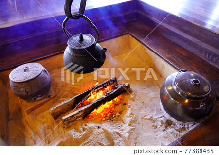 Hearth, old folk house, charcoal fire 77388435