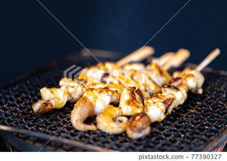 Crested squid skewers charcoal-grilled on a shichirin 77390327