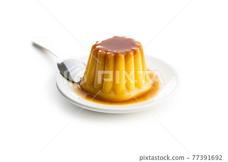 Sweet vanilla pudding. Sweet dessert with caramel topping. Sweet vanilla pudding. Sweet dessert with caramel topping. 77391692