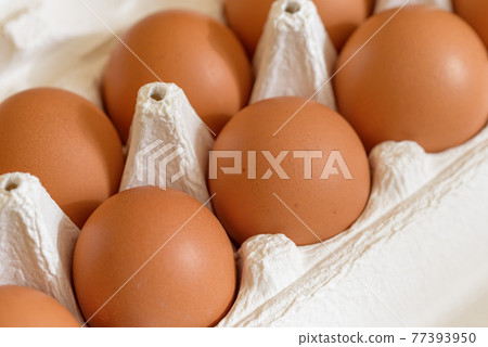 Red egg in a paper carton Red egg in a paper carton 77393950