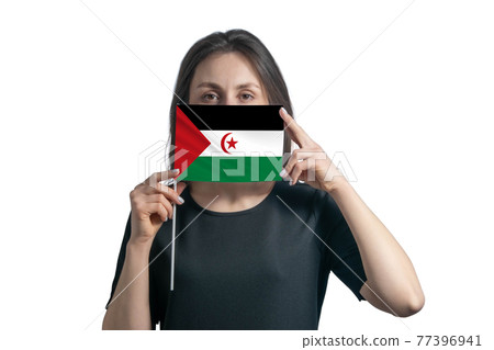 Happy young white woman holding flag Western Sahara flag and covers her face with it isolated on a white background Happy young white woman holding flag Western Sahara flag and covers her face with it isolated on a white background 77396941
