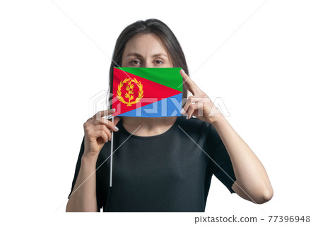 Happy young white woman holding flag Eritrea flag and covers her face with it isolated on a white background Happy young white woman holding flag Eritrea flag and covers her face with it isolated on a white background 77396948
