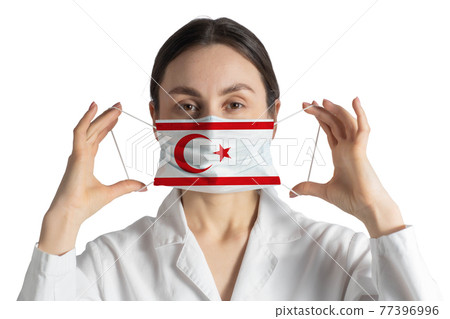 Respirator with flag of Turkish Republic of Northern Cyprus Doctor puts on medical face mask isolated on white background Respirator with flag of Turkish Republic of Northern Cyprus Doctor puts on medical face mask isolated on white background 77396996