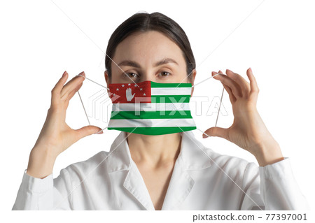 Respirator with flag of Abkhazia Doctor puts on medical face mask isolated on white background Respirator with flag of Abkhazia Doctor puts on medical face mask isolated on white background 77397001