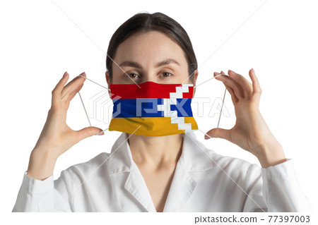 Respirator with flag of Nagorno-Karabakh Republic Doctor puts on medical face mask isolated on white background Respirator with flag of Nagorno-Karabakh Republic Doctor puts on medical face mask isolated on white background 77397003