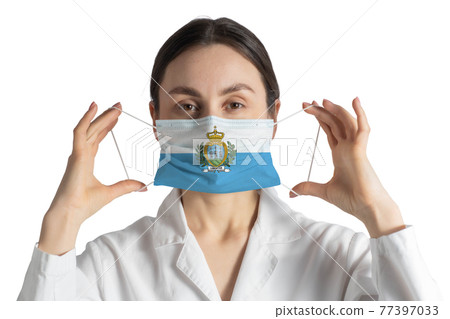 Respirator with flag of San Marino Doctor puts on medical face mask isolated on white background 77397033