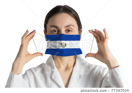 Respirator with flag of El Salvador Doctor puts on medical face mask isolated on white background 77397034