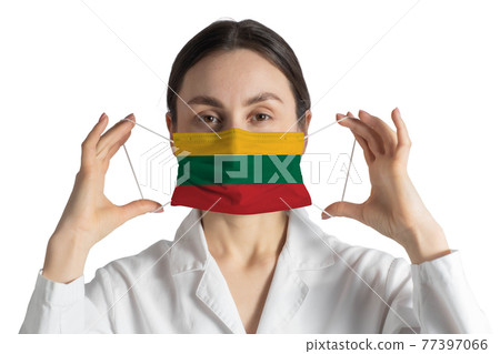 Respirator with flag of Lithuania Doctor puts on medical face mask isolated on white background Respirator with flag of Lithuania Doctor puts on medical face mask isolated on white background 77397066