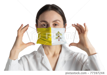 Respirator with flag of Vatican Doctor puts on medical face mask isolated on white background 77397244