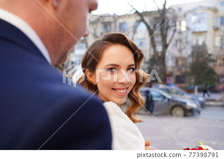 portrait of loving and happy bride. help of coordinator of celebration.  77398791