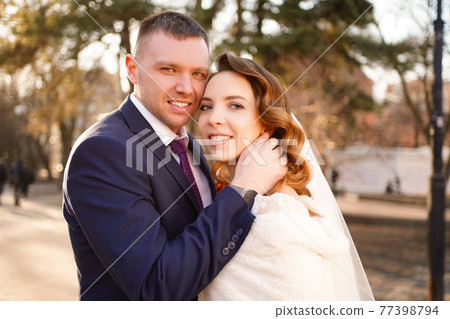 portrait of loving and happy newlywed. help of coordinator of celebration. portrait of loving and happy newlywed. help of coordinator of celebration. 77398794