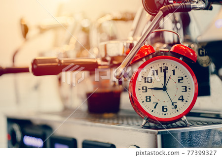 Brew time, Alarm clock with espresso machine for making coffee timing concept Brew time, Alarm clock with espresso machine for making coffee timing concept 77399327