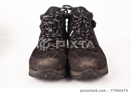 Hiking shoes and a white background, Sturdy hiking boots Hiking shoes and a white background, Sturdy hiking boots 77400474