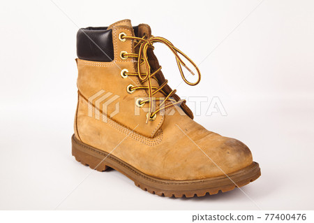 Hiking shoes and a white background, Sturdy hiking boots Hiking shoes and a white background, Sturdy hiking boots 77400476