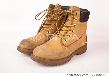 Hiking shoes and a white background, Sturdy hiking boots 77400483