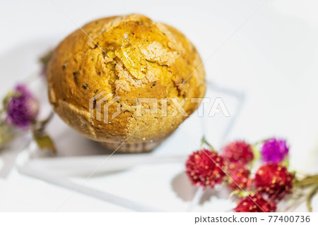 A big muffin that looks delicious A big muffin that looks delicious 77400736