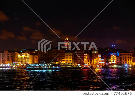 Evening boat trip on the Bosphorus in Istanbul. Bosphorus Bridge, in the night lights 77401676