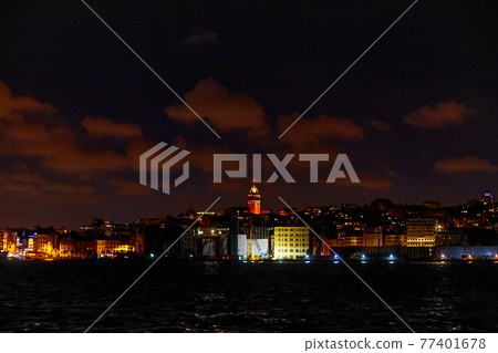 Evening boat trip on the Bosphorus in Istanbul. Bosphorus Bridge, in the night lights Evening boat trip on the Bosphorus in Istanbul. Bosphorus Bridge, in the night lights 77401678