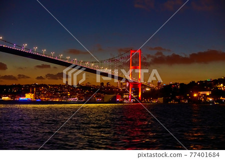 Evening boat trip on the Bosphorus in Istanbul. Bosphorus Bridge, in the night lights Evening boat trip on the Bosphorus in Istanbul. Bosphorus Bridge, in the night lights 77401684