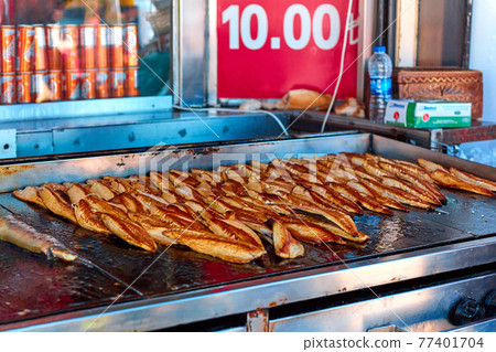 Street counter selling mackerel sandwiches in Istanbul. Street food in Turkey 77401704