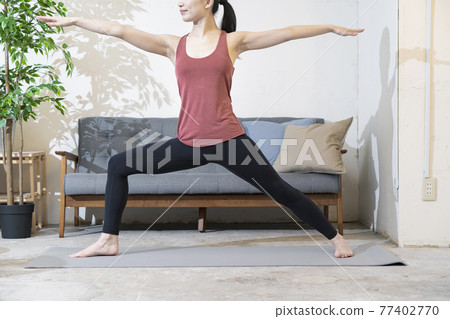 woman doing yoga indoors woman doing yoga indoors 77402770