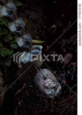 Hanging stone Buddha 77403346