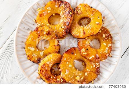 Roasted pineapple with pistachios 77403980